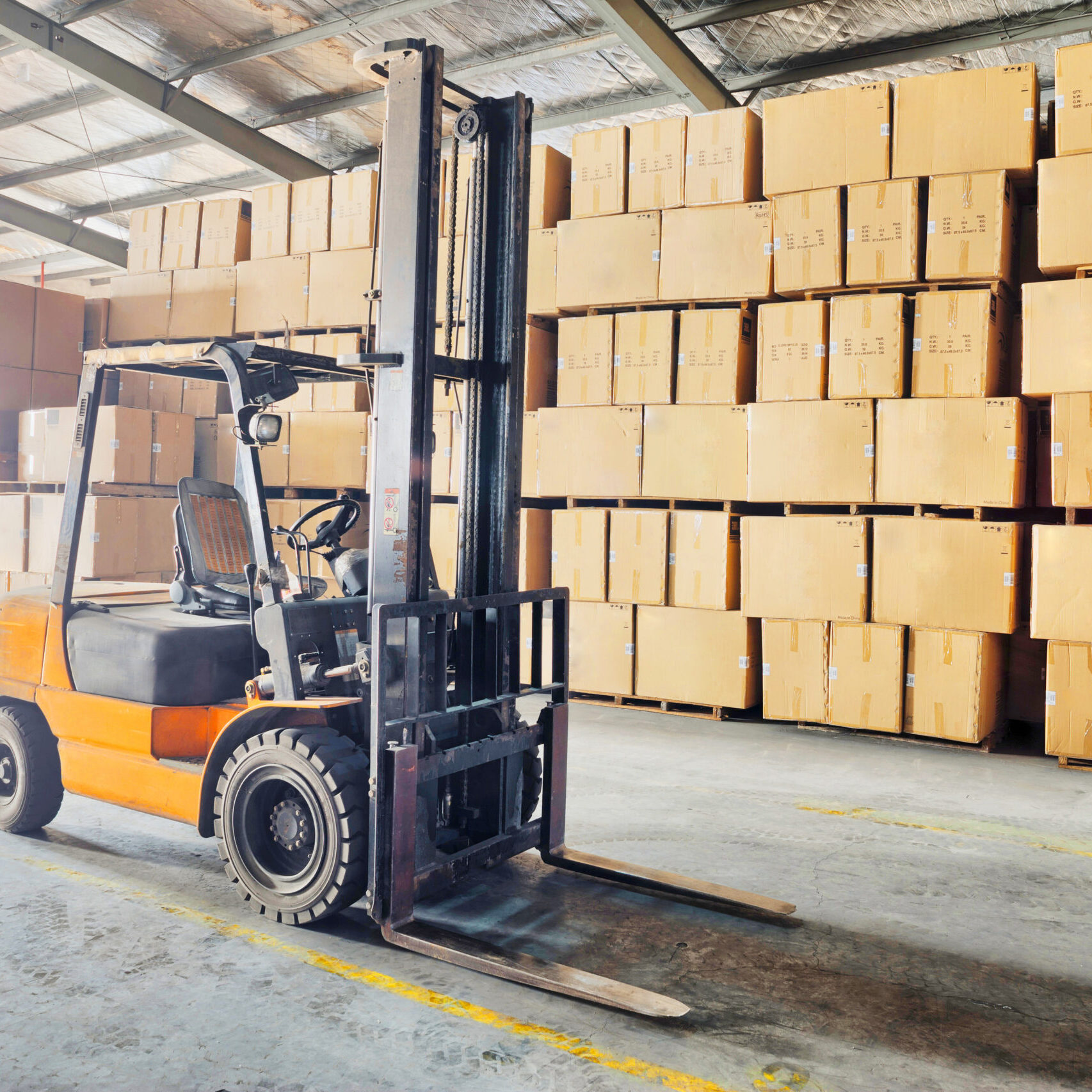 Large modern warehouse with forklifts