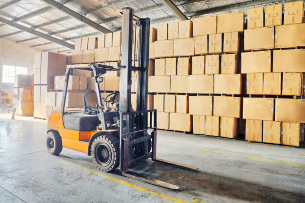 Large modern warehouse with forklifts