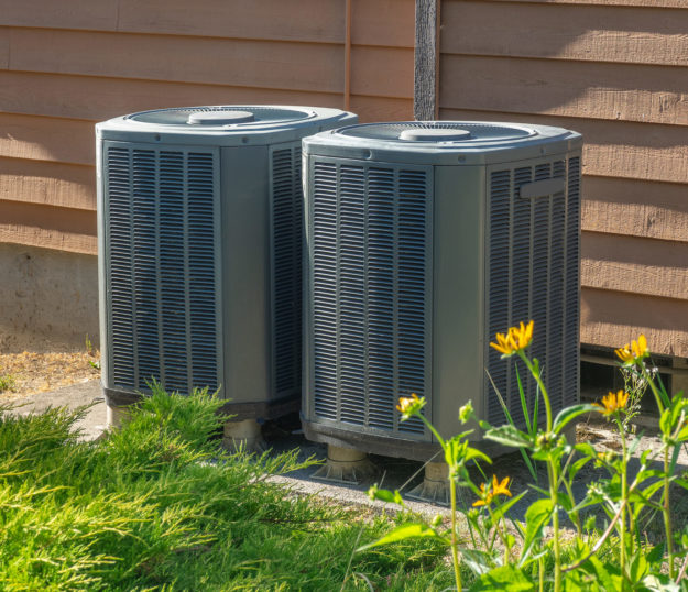 Air conditioning units outside an apartment complex