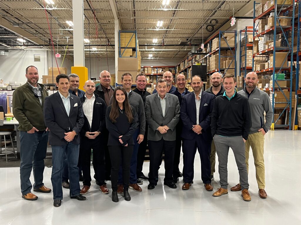 The Spectroline and United Components Team pose together after touring Spectronics' new facility.